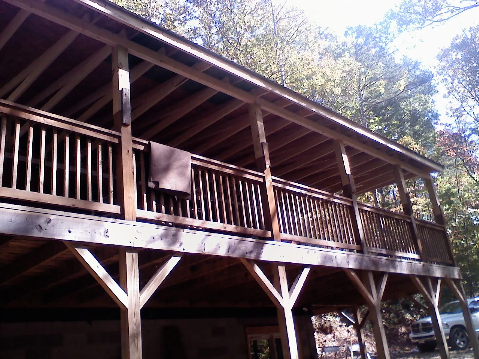 Timber framing under a new elevated porch and deck — Roof Leak Repair in Rochester by Roofing Brothers